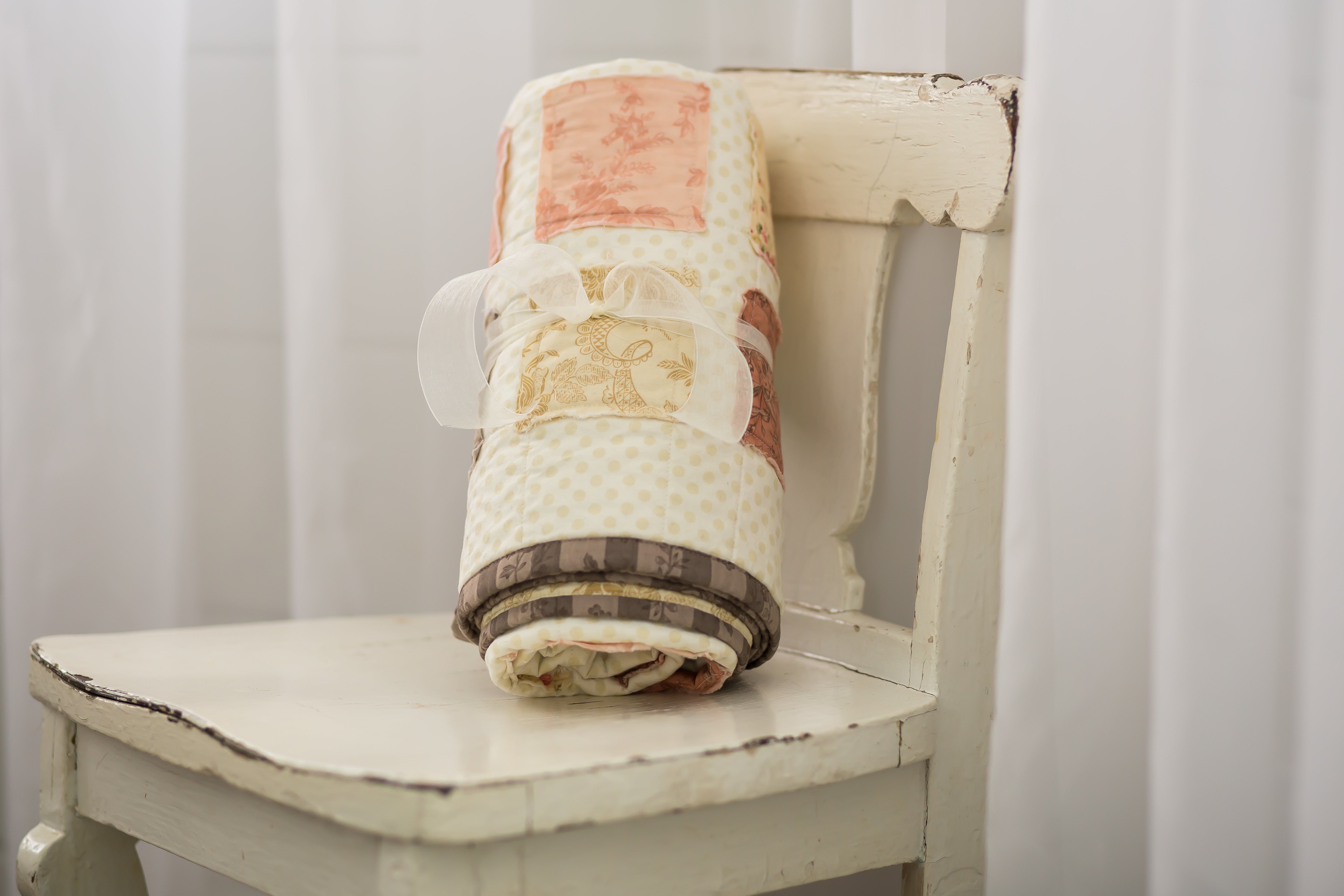 newborn-quilt-on-shabby-chic-chair-classic-baby-room-decor