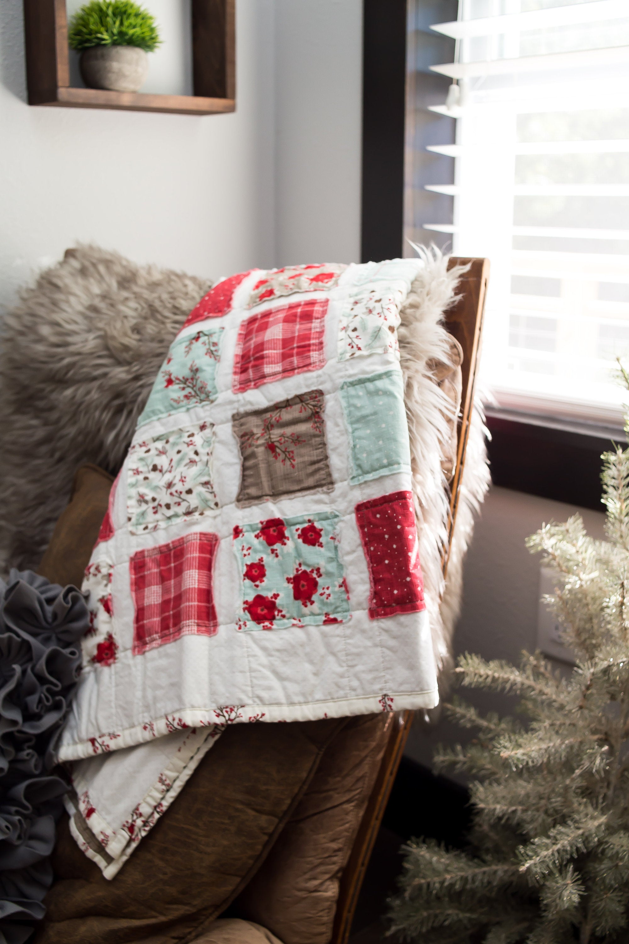 sugar-owl-designs-christmas-quilt-draped-over-a-living-chair